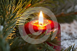 Christmas red candle wit fir closeup photo