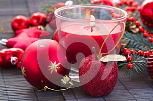 Christmas red decorations woth glowing candle