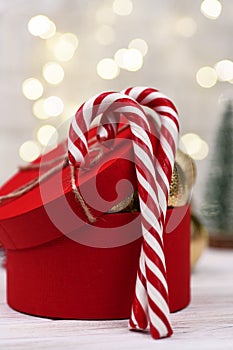 Christmas red gift box Decoration with Candy Canes on bokeh buckground