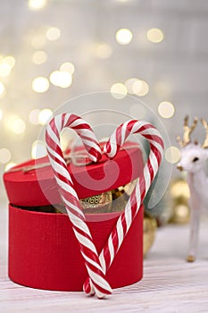 Christmas red gift box Decoration with Candy Canes on bokeh buckground