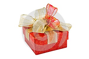 Christmas red gift box with gold ribbon bow, isolated on white b
