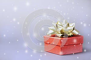 Christmas red gift box and soft blurred background.