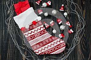 Christmas red sock on a wooden background