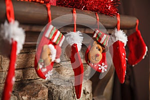 Christmas red stocking hanging from a mantel or fireplace, decor