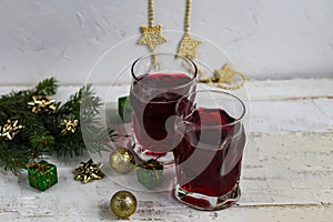 Christmas red wine mulled wine with spices and on a dark background.