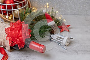 Christmas Red wine and wine opener with santa hat decoration on table