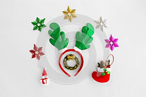 Christmas Reindeer headband and ornaments on white background. photo