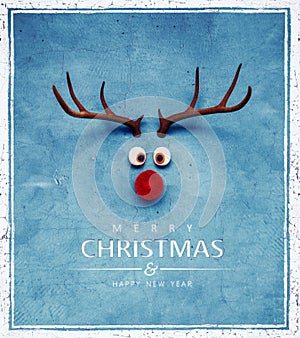 Christmas Reindeer with red cold nose on blue background