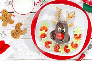 Christmas reindeer shaped burger with tomatoes and cucumbers for kids