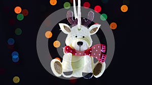 Christmas reindeer swing with blinking lights behind