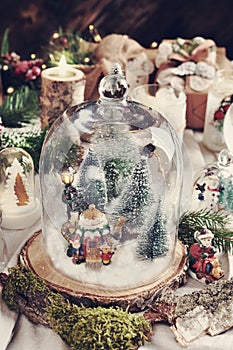 Christmas retro decoration with winter scene inside glass dome