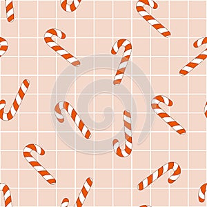 Christmas retro seamless pattern with groovy candy cane on checkerboard background.