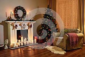 Christmas room interior design, Xmas tree decorated dy lights presents gifts toys, candles and garland lighting indoors fireplace.