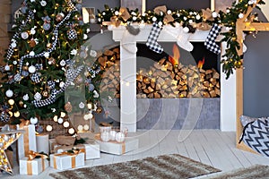 Christmas room interior design, xmas tree decorated with lights, gifts, toys, candles and garlands, fireplace indoor lighting. Dec