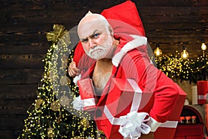 Christmas safety from burglars and home security. Holiday crime scene with bad Santa in the mask with bag.