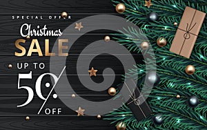 Christmas sale banner. Realistic fir-tree branches with berries and balls. Vector illustration for winter holiday discount. Vector