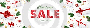 Christmas sale banner. Realistic fir tree branches and presents. Gift boxes with red ribbons. Sale red glitter sparkling