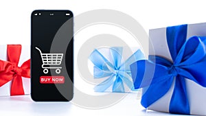 Christmas sale. Internet shop application on digital smartphone screen with gift box red ribbon in online shopping