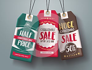 Christmas sale tags hanging vector set in different colors with huge sale and half price text