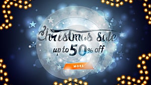 Christmas sale, up to 50% off, blue discount banner with blurred background