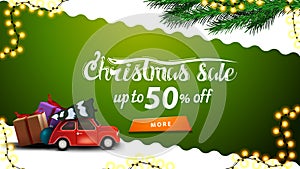 Christmas sale, up to 50% off, green and white discount banner with wavy diagonal line, orange button,Christmas tree branches.