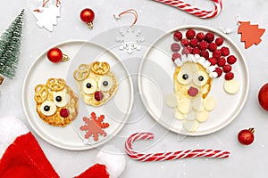 Christmas Santa Claus,deers face shaped pancake with raspberry berry,cheese on plate for kids baby children breakfast dinner