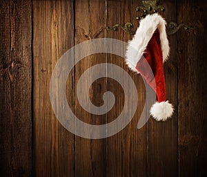 Christmas Santa Claus Hat Hanging On Wood Wall, Xmas Concept