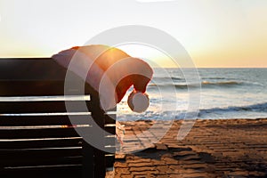 Christmas Santa Claus hat with sun lounger on beautiful tropical summer beach at sunset, calibration on summer holiday vacation at