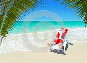 Christmas Santa Claus relax in sunlounger at tropical sandy palm beach