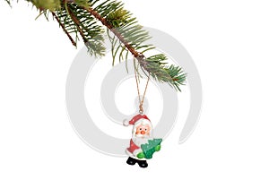 Christmas santa decoration on a spruce tree branch