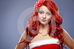 Christmas Santa hat redhair woman portrait . photo
