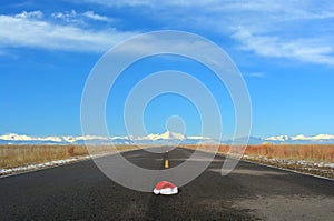 Christmas Santa Hat In Road Travel Concept