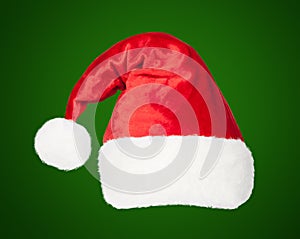 Christmas Santa red hat isolated on green