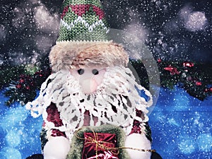 Christmas santa toy with fir branches decor and snow