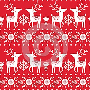 Christmas Scandinavian seamless pattern with reindeer, snowflakes and flowers on red background.