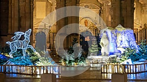 Christmas scene, bright Christmas decorations, deer and polar bear in the heart of the city