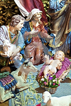 Christmas scene with figures of Jesus, Mary and Magus
