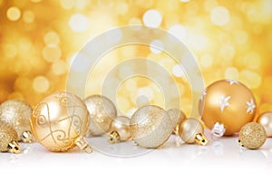 Christmas scene with gold baubles, gold background