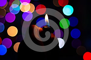 christmas scenery silent night candle light on dark with colorful blur background photo