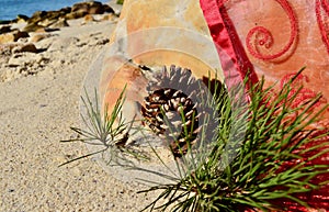 Christmas by the sea beach sand pine cones burgundy red organza throw Christmas in July