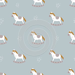 Christmas seamless pattern with childish rocking horses.