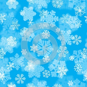 Christmas seamless pattern of fuzzy and focused snowflakes