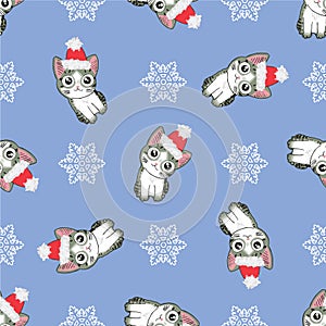 Christmas seamless pattern with the image of little cute kittens in the hat of Santa Claus.