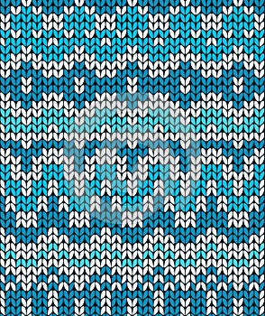 Christmas seamless pattern. Knitting traditional texture. Blue winter background.