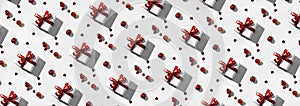 Christmas seamless pattern with red gift boxes and decoration, sparkles and confetti on white background. Xmas and New Year