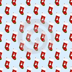 Christmas seamless pattern with red stockings. Geometric digital paper from xmas gift socks. On the felt boot there is drawing of