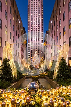Christmas season decorations at Rockefeller Center Plaza with Christmas tree and holiday lights. Fifth Avenue, New York City