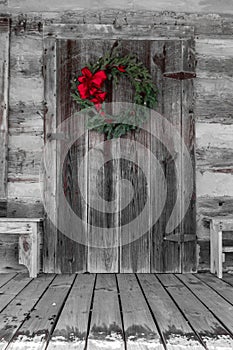 Christmas Wreath Hung on the Log Cabin Door