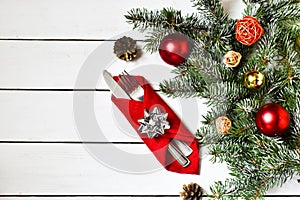 Christmas serving cutlery with plate on a wooden background. New year and christmas concept.