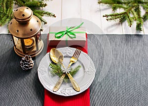 Christmas serving table. Traditional festive decoration background top view. Cutlery utensils beautiful plates decorative elements